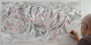 James Niehues paints the new PCMR trail map.