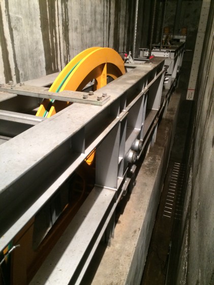 220,000 lb. concrete counterweight suspended under the top terminal.